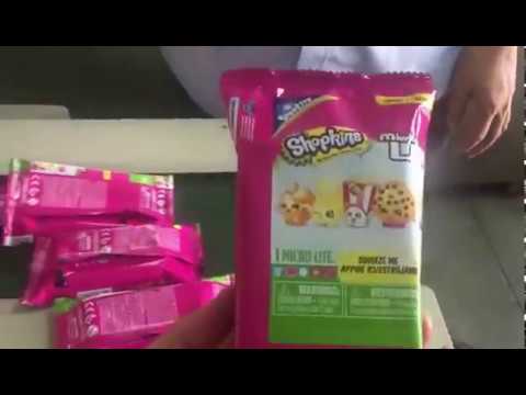 Efficient and reliable horizontal flow wrapping machines for electronics hardware packaging