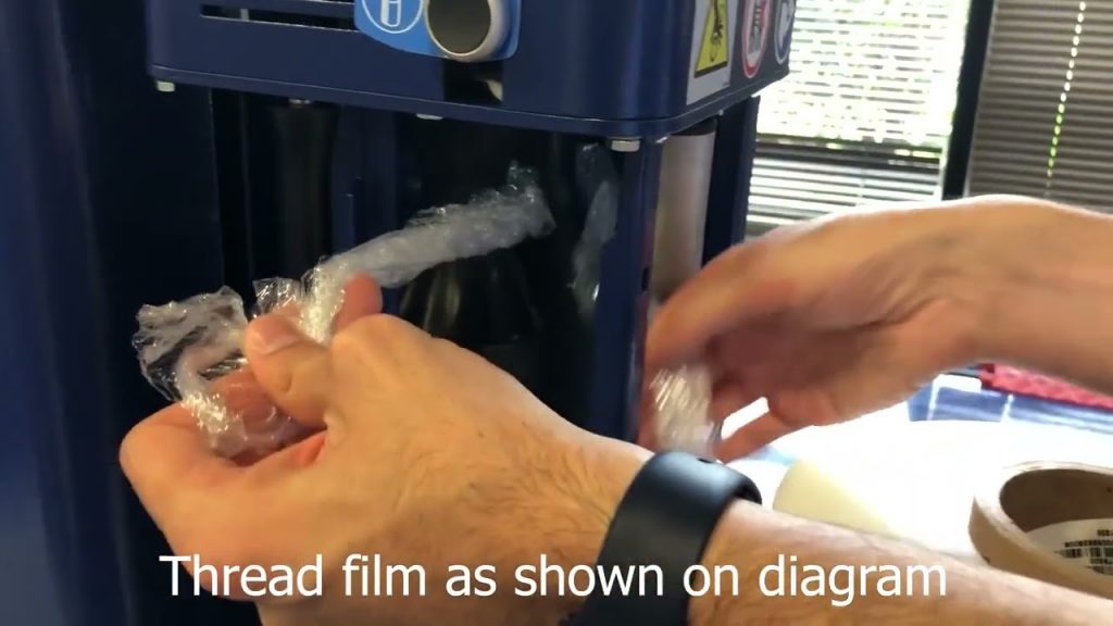 “Effortlessly Load Film onto a Robopac Masterplat Semi Automatic Stretch Wrapper Film Carriage” “Effortlessly Load Film onto a Robopac Masterplat Semi Automatic Stretch Wrapper Film Carriage”